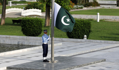 A member of the Pakistan Air Force rehearses flag